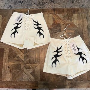 12th TRIBE “Danica White Vegan Leather Shorts”